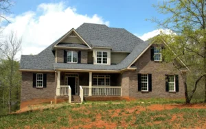 Brick suburban home in Allen TX with asphalt shingle roof after a hailstorm